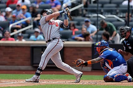 Aug 12, 2023; New York City, New York, USA; Atlanta Braves third baseman Austin Riley (27) follows through on an RBI single against the New York Mets during the first inning at Citi Field. Mandatory Credit: Brad Penner-USA TODAY Sports