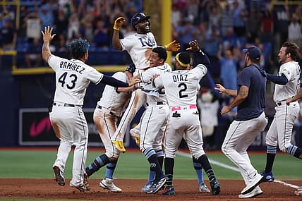 Aug 12, 2023; St. Petersburg, Florida, USA;  Tampa Bay Rays left fielder Randy Arozarena (56) is congratulated after he hit a walk off RBI single against the Cleveland Guardians during the ninth inning at Tropicana Field. Mandatory Credit: Kim Klement Neitzel-USA TODAY Sports