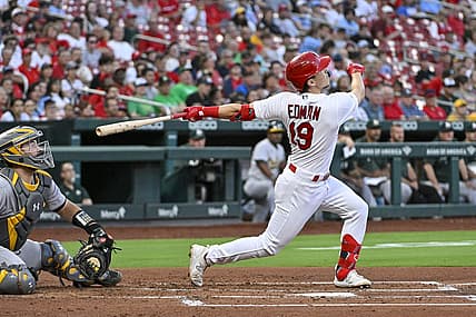 Aug 14, 2023; St. Louis, Missouri, USA;  St. Louis Cardinals shortstop Tommy Edman (19) hits one run single against the Oakland Athletics during the second inning at Busch Stadium. Mandatory Credit: Jeff Curry-USA TODAY Sports