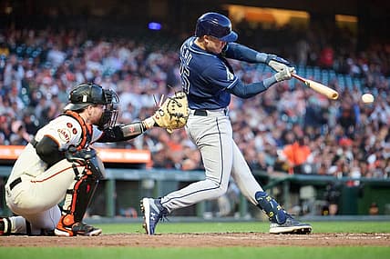 Aug 14, 2023; San Francisco, California, USA; Tampa Bay Rays infielder Curtis Mead (25) hits an infield single against the San Francisco Giants during the fifth inning at Oracle Park. Mandatory Credit: Robert Edwards-USA TODAY Sports