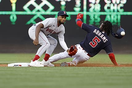 Aug 15, 2023; Washington, District of Columbia, USA; Washington Nationals shortstop CJ Abrams (5) steals second base ahead of a tag by Boston Red Sox shortstop Pablo Reyes (19) during the first inning at Nationals Park. Mandatory Credit: Geoff Burke-USA TODAY Sports