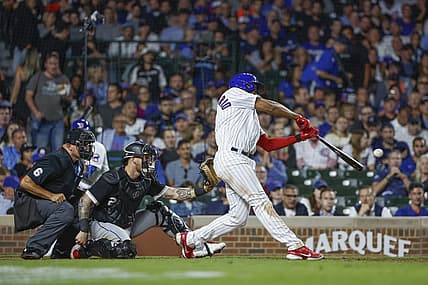 Aug 15, 2023; Chicago, Illinois, USA; Chicago Cubs third baseman Jeimer Candelario (9) singles against the Chicago White Sox during the sixth inning at Wrigley Field. Mandatory Credit: Kamil Krzaczynski-USA TODAY Sports