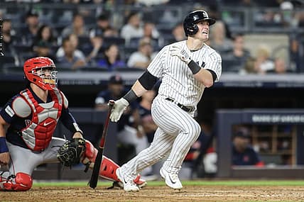 Aug 18, 2023; Bronx, New York, USA; New York Yankees left fielder Billy McKinney (57) hits a single in the fourth inning against the Boston Red Sox at Yankee Stadium. Mandatory Credit: Wendell Cruz-USA TODAY Sports