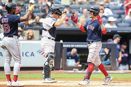Aug 19, 2023; Bronx, New York, USA;  Boston Red Sox second baseman Luis Urias (right) is greeted by shortstop Pablo Reyes (19) after hitting a grand slam home run in the second inning against the New York Yankees at Yankee Stadium. Mandatory Credit: Wendell Cruz-USA TODAY Sports