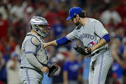 Aug 19, 2023; Cincinnati, Ohio, USA; Toronto Blue Jays relief pitcher Jordan Romano (68) celebrates with catcher Alejandro Kirk (30) after their victory over the Cincinnati Reds at Great American Ball Park. Mandatory Credit: Katie Stratman-USA TODAY Sports