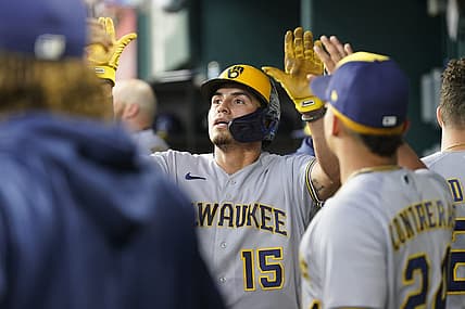 Aug 20, 2023; Arlington, Texas, USA; Milwaukee Brewers right fielder Tyrone Taylor (15) celebrates scoring a run on a double hit by Milwaukee Brewers left fielder Christian Yelich (22) against the Texas Rangers during the fourth inning at Globe Life Field. Mandatory Credit: Jim Cowsert-USA TODAY Sports