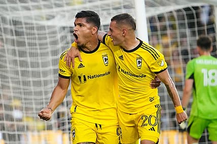 Aug 20, 2023; Columbus, Ohio, USA; Columbus Crew forward Cucho Hernandez (9) celebrates scoring a penalty kick goal with midfielder Alexandru Matan (20) behind FC Cincinnati goalkeeper Roman Celentano (18) during the first half of the MLS soccer match at Lower.com Field.