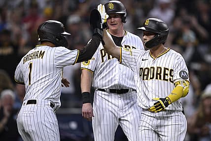 Aug 21, 2023; San Diego, California, USA; San Diego Padres second baseman Ha-seong Kim (7) is congratulated by center fielder Trent Grisham (1) after hitting a grand slam home run against the Miami Marlins during the second inning at Petco Park. Mandatory Credit: Orlando Ramirez-USA TODAY Sports
