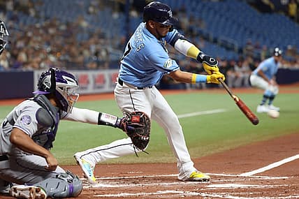 Aug 22, 2023; St. Petersburg, Florida, USA; Tampa Bay Rays third baseman Isaac Paredes (17) hits a sacrifice RBI against the Colorado Rockies during the first inning at Tropicana Field. Mandatory Credit: Kim Klement Neitzel-USA TODAY Sports