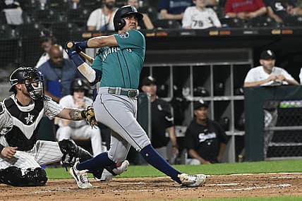 Aug 22, 2023; Chicago, Illinois, USA; Seattle Mariners third baseman Josh Rojas (4) hits a two run home run against the Chicago White Sox during the fourth inning at Guaranteed Rate Field. Mandatory Credit: Matt Marton-USA TODAY Sports