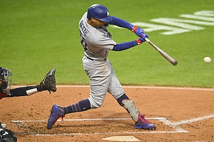 Aug 23, 2023; Cleveland, Ohio, USA; Los Angeles Dodgers right fielder Mookie Betts (50) singles in the second inning against the Cleveland Guardians at Progressive Field. Mandatory Credit: David Richard-USA TODAY Sports