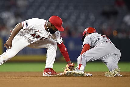Aug 23, 2023; Anaheim, California, USA; Cincinnati Reds center fielder TJ Friedl (29) steals second base ahead of the tag by Los Angeles Angels second baseman Luis Rengifo (2) during the fifth inning at Angel Stadium. Mandatory Credit: Orlando Ramirez-USA TODAY Sports