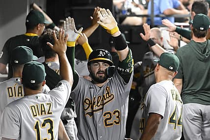 Aug 24, 2023; Chicago, Illinois, USA;  Oakland Athletics catcher Shea Langeliers (23) celebrates in the dugout after he hits a three run homerun against the Chicago White Sox during the fourth inning at Guaranteed Rate Field. Mandatory Credit: Matt Marton-USA TODAY Sports