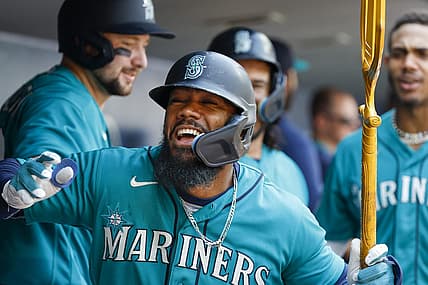 Aug 28, 2023; Seattle, Washington, USA; Seattle Mariners right fielder Teoscar Hernandez (35) celebrates in the dugout after hitting a grand slam home run against the Kansas City Royals during the third inning at T-Mobile Park. Mandatory Credit: Joe Nicholson-USA TODAY Sports