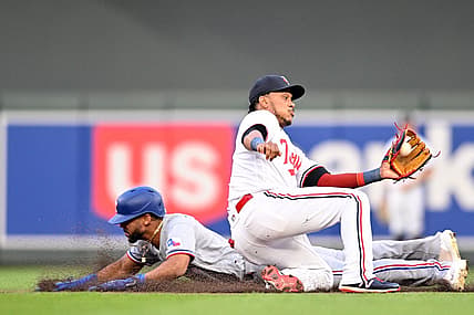 Aug 26, 2023; Minneapolis, Minnesota, USA; Texas Rangers center fielder Leody Taveras (3) slides in safe while stealing second base as Minnesota Twins second baseman Jorge Polanco (11) catches the ball to apply the tag during the fifth inning at Target Field. Mandatory Credit: Jeffrey Becker-USA TODAY Sports