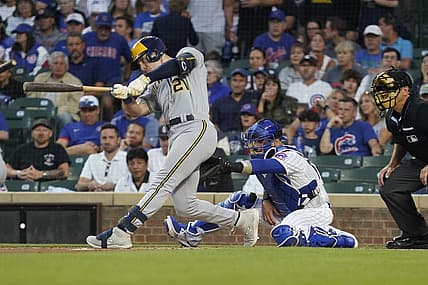 Aug 28, 2023; Chicago, Illinois, USA; Milwaukee Brewers designated hitter Mark Canha (21) hits a two-run home run against the Chicago Cubs during the first inning at Wrigley Field. Mandatory Credit: David Banks-USA TODAY Sports