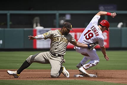 Aug 30, 2023; St. Louis, Missouri, USA;  St. Louis Cardinals center fielder Tommy Edman (19) slides safely past the tag of San Diego Padres shortstop Xander Bogaerts (2) for a stolen base during the first inning at Busch Stadium. Mandatory Credit: Jeff Curry-USA TODAY Sports