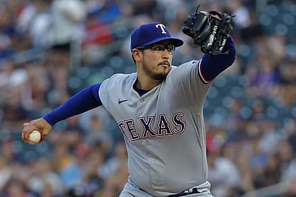 Aug 25, 2023; Minneapolis, Minnesota, USA; Texas Rangers starting pitcher Dane Dunning (33) throws to the Minnesota Twins in the first inning at Target Field. Mandatory Credit: Bruce Kluckhohn-USA TODAY Sports