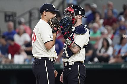 Sep 1, 2023; Arlington, Texas, USA; Texas Rangers relief pitcher Brock Burke (46) and Texas Rangers catcher Jonah Heim (28) talk on mound between pitches against the Minnesota Twins at Globe Life Field. Mandatory Credit: Raymond Carlin III-USA TODAY Sports