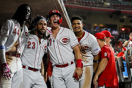Sep 5, 2023; Cincinnati, Ohio, USA; Cincinnati Reds pinch hitter Nick Martini (23) reacts after hitting a three-run home run with shortstop Elly De La Cruz (44), pinch hitter Tyler Stephenson (37) and third baseman Noelvi Marte (16) in the eighth inning against the Seattle Mariners at Great American Ball Park. Mandatory Credit: Katie Stratman-USA TODAY Sports