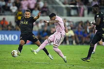 Sep 3, 2023; Los Angeles, California, USA; Inter Miami CF midfielder Facundo Far  as (11) moves the ball against LAFC defender Aaron Long (33) at BMO Stadium. Mandatory Credit: Kirby Lee-USA TODAY Sports