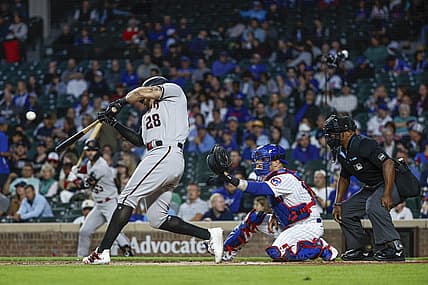 Sep 7, 2023; Chicago, Illinois, USA; Arizona Diamondbacks left fielder Tommy Pham (28) hits a solo home run against the Chicago Cubs during the first inning at Wrigley Field. Mandatory Credit: Kamil Krzaczynski-USA TODAY Sports