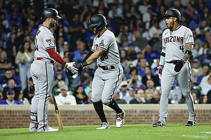 Sep 7, 2023; Chicago, Illinois, USA; Arizona Diamondbacks left fielder Tommy Pham (28) celebrates with first baseman Christian Walker (53) after hitting a two-run home run against the Chicago Cubs during the eight inning at Wrigley Field. Mandatory Credit: Kamil Krzaczynski-USA TODAY Sports
