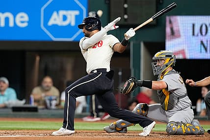 Sep 9, 2023; Arlington, Texas, USA; Texas Rangers left fielder Ezequiel Duran (20) singles against the Oakland Athletics during the second inning at Globe Life Field. Mandatory Credit: Jim Cowsert-USA TODAY Sports