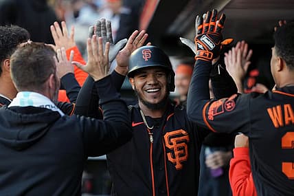 Sep 9, 2023; San Francisco, California, USA; San Francisco Giants second baseman Thairo Estrada (center) is congratulated by teammates after hitting a home run against the Colorado Rockies during the first inning at Oracle Park. Mandatory Credit: Darren Yamashita-USA TODAY Sports