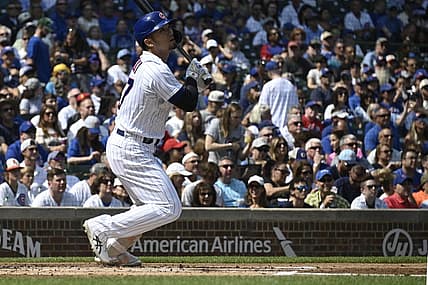 Sep 10, 2023; Chicago, Illinois, USA;  Chicago Cubs right fielder Seiya Suzuki (27) hits an RBI double against the Arizona Diamondbacks during the first inning at Wrigley Field. Mandatory Credit: Matt Marton-USA TODAY Sports
