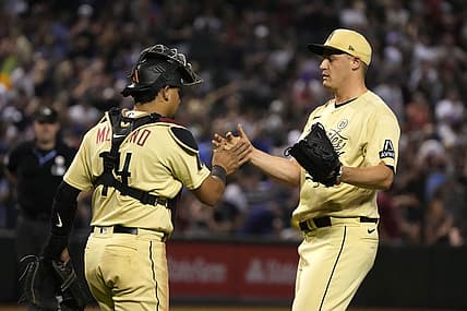 Sep 15, 2023; Phoenix, Arizona, USA; Arizona Diamondbacks catcher Gabriel Moreno (14) and pitcher Paul Sewald (38) celebrate after defeating the Chicago Cubs at Chase Field. Mandatory Credit: Rick Scuteri-USA TODAY Sports