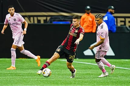 Sep 16, 2023; Atlanta, Georgia, USA; Atlanta United midfielder Matheus Rossetto (20) dribbles the ball against Inter Miami CF defender DeAndre Yedlin (2) during the first half at Mercedes-Benz Stadium. Mandatory Credit: John David Mercer-USA TODAY Sports