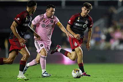Sep 20, 2023; Fort Lauderdale, Florida, USA; Inter Miami forward Lionel Messi (10) kicks the ball past Toronto FC during the first half at DRV PNK Stadium. Mandatory Credit: Sam Navarro-USA TODAY Sports