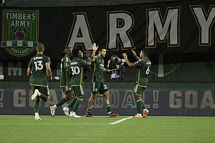 Sep 20, 2023; Portland, Oregon, USA;  Portland Timbers midfielder Cristhian Paredes (22) celebrates with teammates after scoring against San Jose Earthquakes during the first half at Providence Park. Mandatory Credit: Troy Wayrynen-USA TODAY Sports