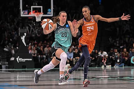 Sep 26, 2023; Brooklyn, New York, USA; New York Liberty guard Sabrina Ionescu (20) drives to the basket against Connecticut Sun forward DeWanna Bonner (24) during the second half of game two of the 2023 WNBA Playoffs at Barclays Center. Mandatory Credit: John Jones-USA TODAY Sports
