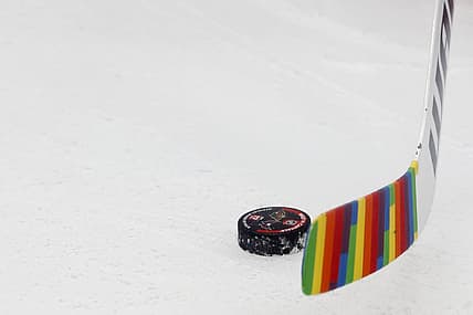 Jan 17, 2023; Washington, District of Columbia, USA; Washington Capitals goaltender Darcy Kuemper (35) handles a puck during warmup with rainbow stick tape in recognition of Pride Night prior to their game against the Minnesota Wild at Capital One Arena. Mandatory Credit: Geoff Burke-USA TODAY Sports