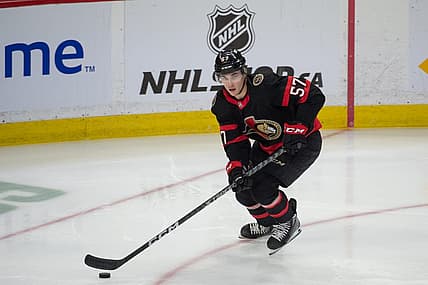 Mar 30, 2023; Ottawa, Ontario, CAN; Ottawa Senators center Shane Pinto (57) skates with the puck in the third period againstthe Philadelphia Flyers at the Canadian Tire Centre. Mandatory Credit: Marc DesRosiers-USA TODAY Sports