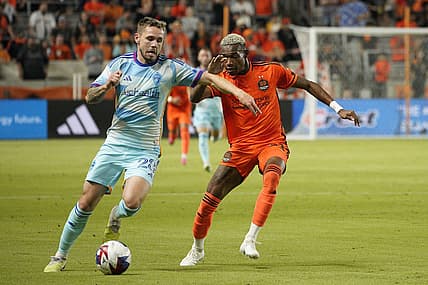 Oct 7, 2023; Houston, Texas, USA; Colorado Rapids midfielder Sam Nicholson (28) dribbles against Houston Dynamo forward Nelson Quinones (21) during the first half at Shell Energy Stadium. Mandatory Credit: Dustin Safranek-USA TODAY Sports