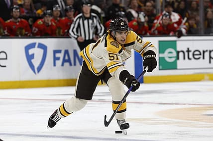 Oct 11, 2023; Boston, Massachusetts, USA; Boston Bruins center Matthew Poitras (51) makes a pass against the Chicago Blackhawks during the second period at TD Garden. Mandatory Credit: Winslow Townson-USA TODAY Sports