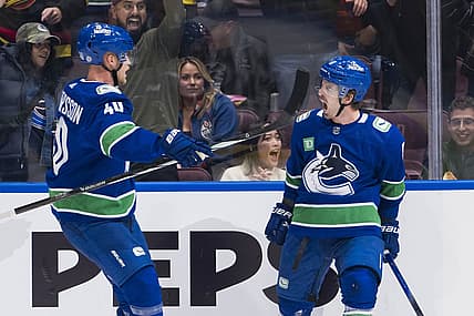 Oct 11, 2023; Vancouver, British Columbia, CAN; Vancouver Canucks forward Elias Pettersson (40) and forward Conor Garland (8) celebrate Garland   s goal against the Edmonton Oilers in the first period at Rogers Arena. Mandatory Credit: Bob Frid-USA TODAY Sports