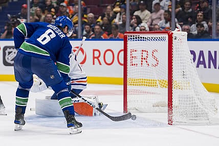 Oct 11, 2023; Vancouver, British Columbia, CAN; Vancouver Canucks forward Brock Boeser (6) scores his fourth goal of the night on Edmonton Oilers goalie Stuart Skinner (74) in the third period at Rogers Arena. Vancouver won 8-1. Mandatory Credit: Bob Frid-USA TODAY Sports
