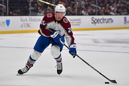 Oct 11, 2023; Los Angeles, California, USA; Colorado Avalanche center Ross Colton (20) moves the puck against the Los Angeles Kings during the first period at Crypto.com Arena. Mandatory Credit: Gary A. Vasquez-USA TODAY Sports