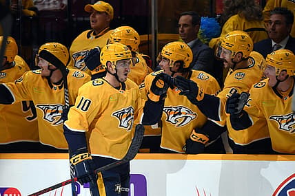Oct 12, 2023; Nashville, Tennessee, USA; Nashville Predators center Colton Sissons (10) is congratulated by teammates after a goal during the second period against the Seattle Kraken at Bridgestone Arena. Mandatory Credit: Christopher Hanewinckel-USA TODAY Sports