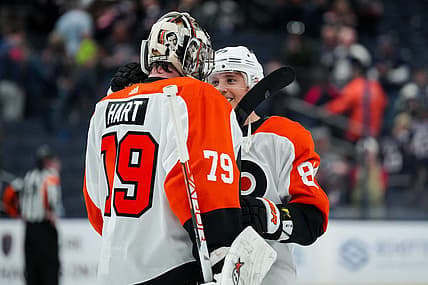 Oct 12, 2023; Columbus, Ohio, USA;  Philadelphia Flyers goaltender Carter Hart (79) and right wing Cam Atkinson (89) celebrate on the ice after defeating the Columbus Blue Jackets at Nationwide Arena. Mandatory Credit: Aaron Doster-USA TODAY Sports