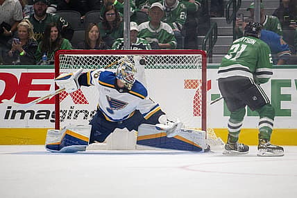 Oct 12, 2023; Dallas, Texas, USA; Dallas Stars left wing Jason Robertson (21) scores a goal against St. Louis Blues goaltender Jordan Binnington (50) during the overtime shootout period at the American Airlines Center. Mandatory Credit: Jerome Miron-USA TODAY Sports