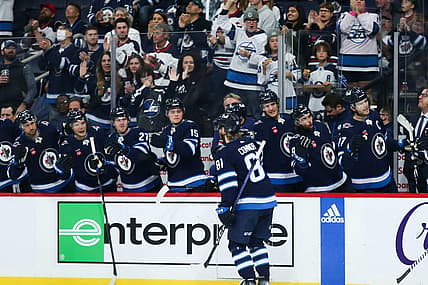 Oct 14, 2023; Winnipeg, Manitoba, CAN;  Winnipeg Jets forward Kyle Connor (81) is celebrates with teammates after scoring a goal against the Florida Panthers during the second period at Canada Life Centre. Mandatory Credit: Terrence Lee-USA TODAY Sports