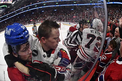 Oct 14, 2023; Montreal, Quebec, CAN; Montreal Canadiens forward Josh Anderson (17) and Chicago Blackhawks defenseman Jarred Tinordi (25) during the first period at the Bell Centre. Mandatory Credit: Eric Bolte-USA TODAY Sports