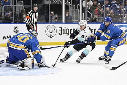 Oct 14, 2023; St. Louis, Missouri, USA; St. Louis Blues goaltender Jordan Binnington (50) and defenseman Marco Scandella (6) defend the net from Seattle Kraken center Yanni Gourde (37) during the first period at Enterprise Center. Mandatory Credit: Jeff Le-USA TODAY Sports