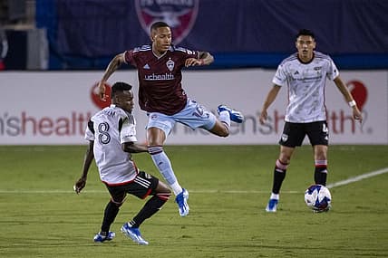 Oct 14, 2023; Frisco, TX, USA; Colorado Rapids forward Calvin Harris (14) leaps over FC Dallas forward Jader Obrian (8) during the first half at Toyota Stadium. Mandatory Credit: Jerome Miron-USA TODAY Sports