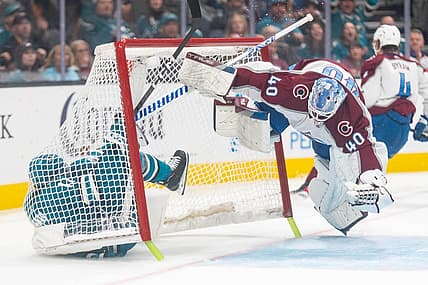 Oct 14, 2023; San Jose, California, USA; Colorado Avalanche goaltender Alexandar Georgiev (40) dodges San Jose Sharks center Luke Kunin (11) during the second period at SAP Center at San Jose. Mandatory Credit: Stan Szeto-USA TODAY Sports